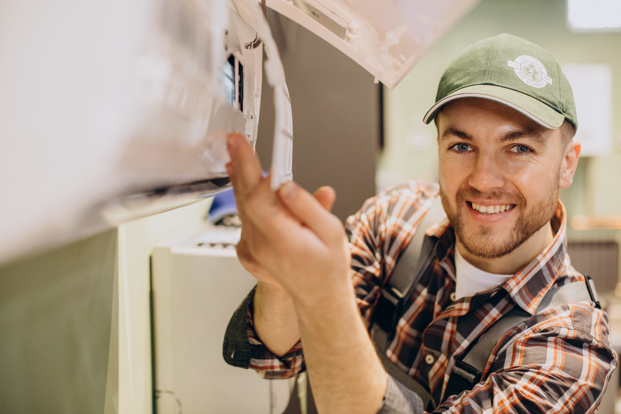 Repairman doing air conditioner servise