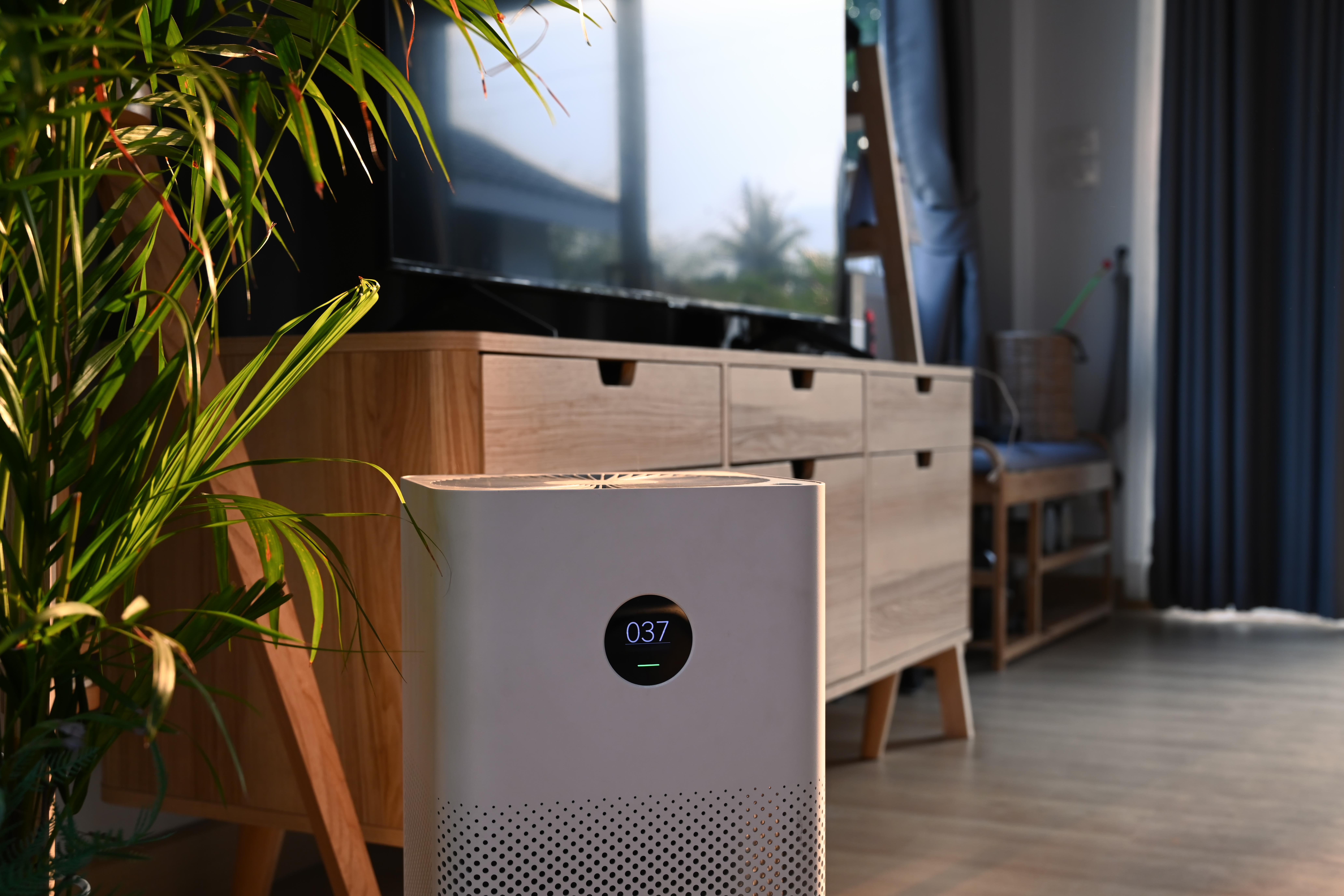 Close up view of portable air purifier on wooden floor in comfor